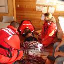 mini SAREX 2015: Upon arrival to the float house, RCMSAR 50 members met a hysterical woman who informed the members that there was a victim inside the float house who had fallen down the stairs to the second floor. The crew retrieved their first aid kit and entered the residence to evaluate the situation. They approached the victim and evaluated that there was no pulse, breathing or circulation. CPR was started after stabilizing the spinal cord of the victim. 